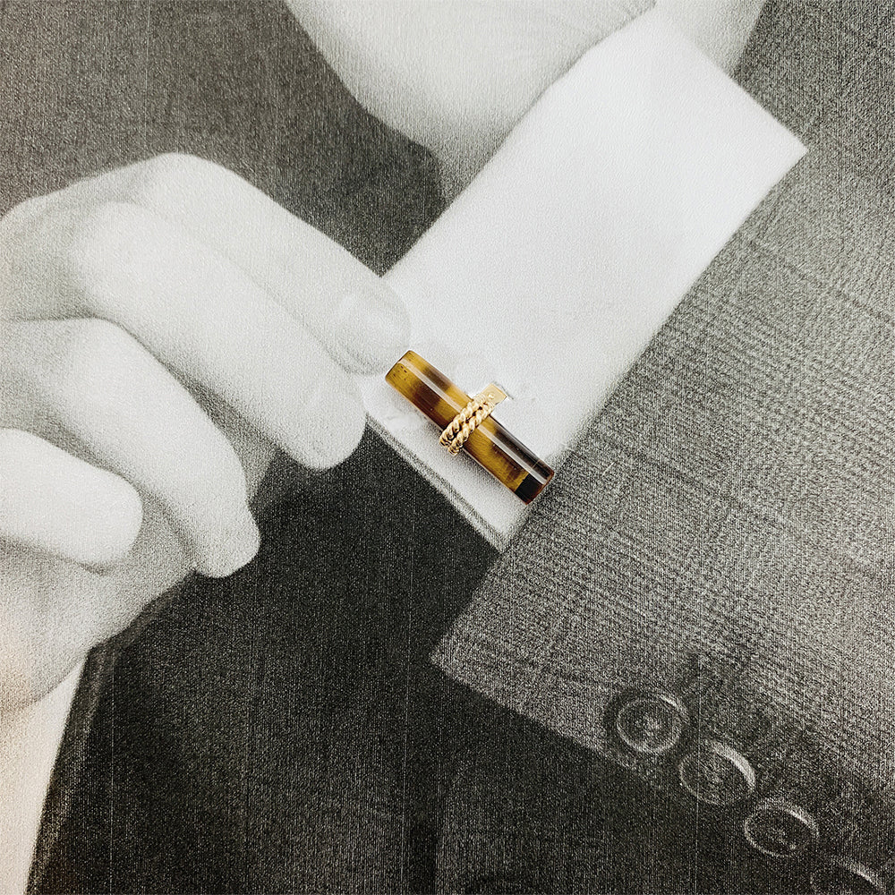 Boucheron cufflinks in yellow gold and tiger's eye.