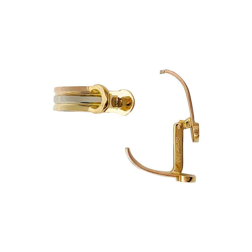 Cartier "Mini Ressort CC" three-tone cufflinks.