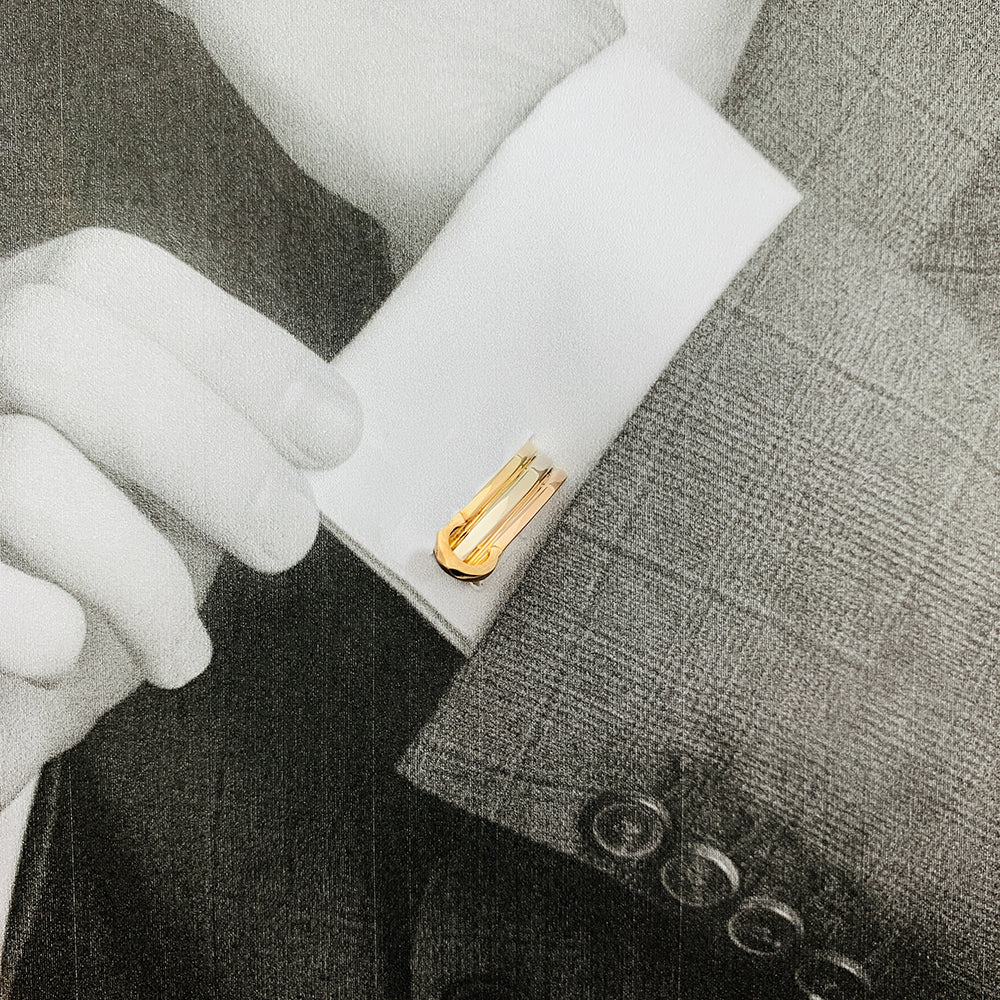 Cartier "Mini Ressort CC" three-tone cufflinks.
