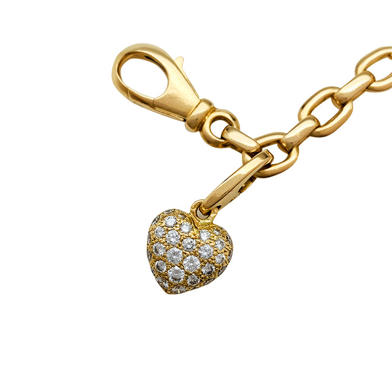 Cartier bracelet in yellow gold, 5 charms, diamonds, emeralds and rubies.