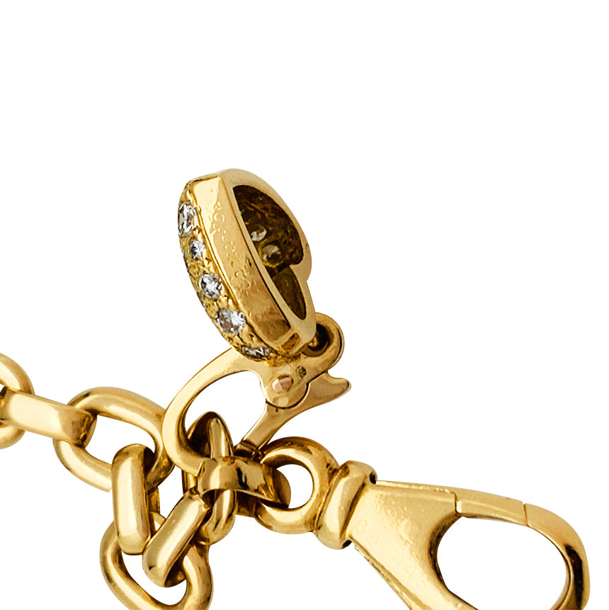 Cartier bracelet in yellow gold, 5 charms, diamonds, emeralds and rubies.