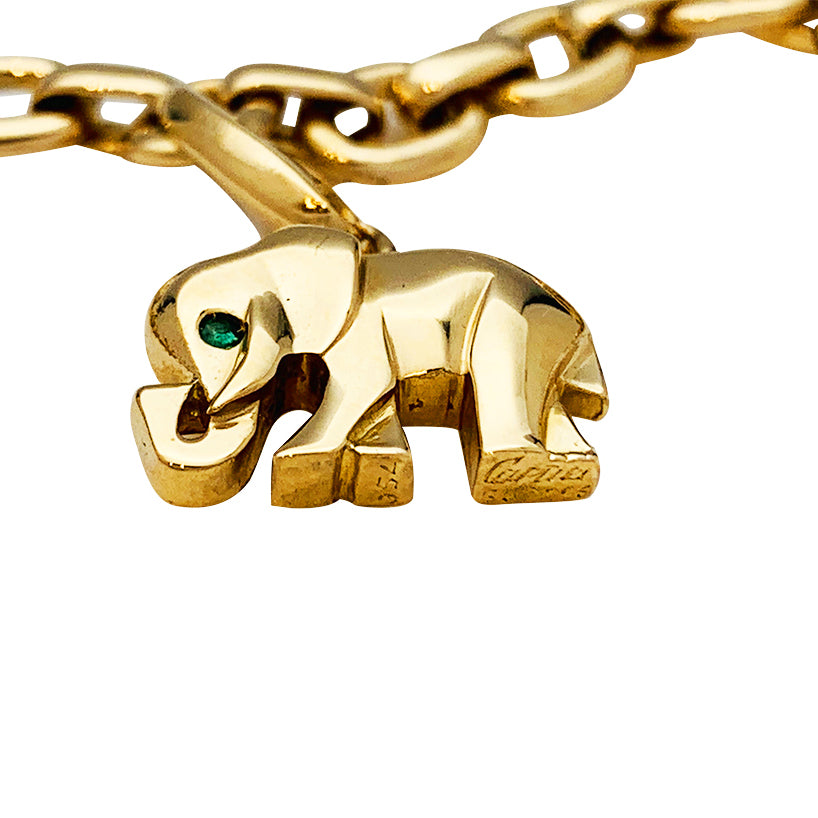Cartier bracelet in yellow gold, 5 charms, diamonds, emeralds and rubies.
