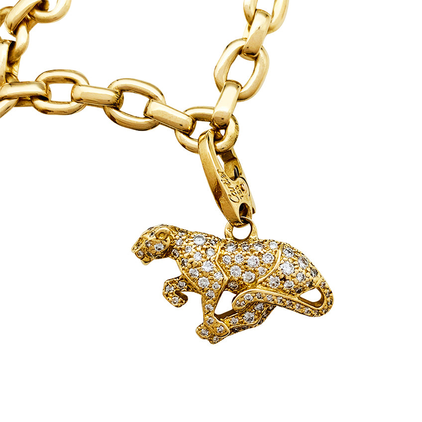 Cartier bracelet in yellow gold, 5 charms, diamonds, emeralds and rubies.
