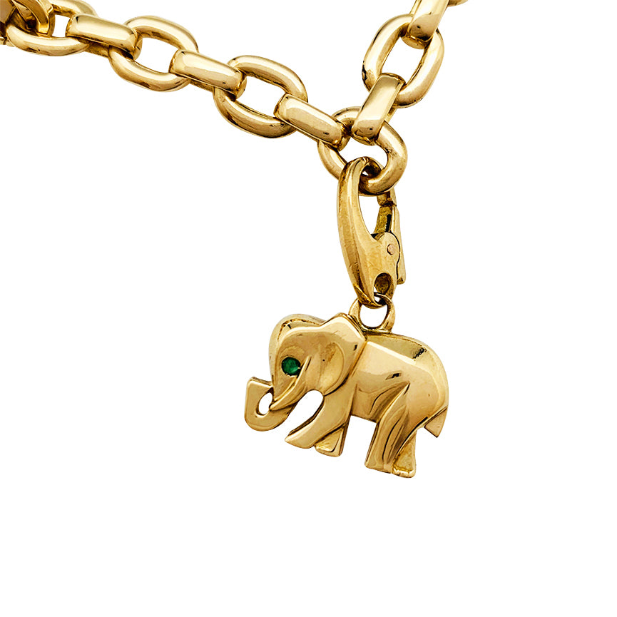 Cartier bracelet in yellow gold, 5 charms, diamonds, emeralds and rubies.