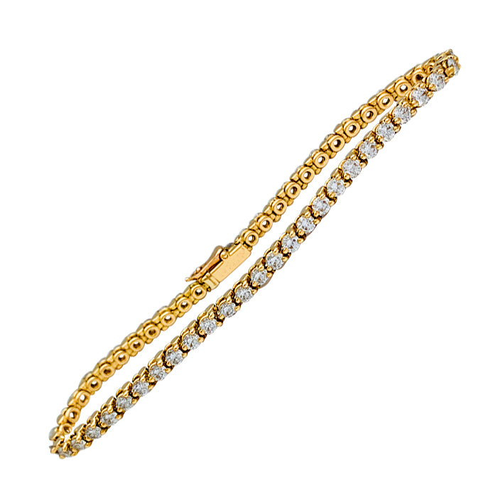 Bracelet Cartier ligne en or jaune serti de diamants.
