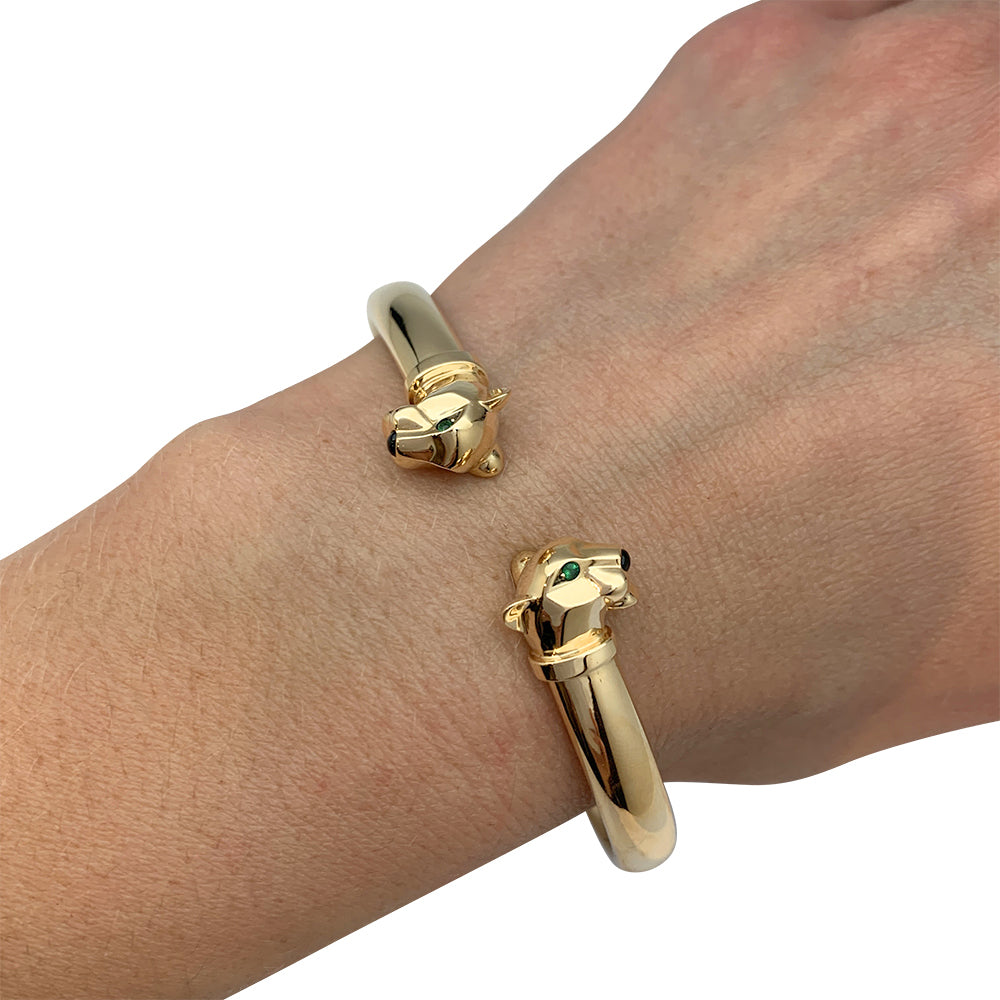 Cartier "Panthère" bracelet in yellow gold, tsavorites and onyx.