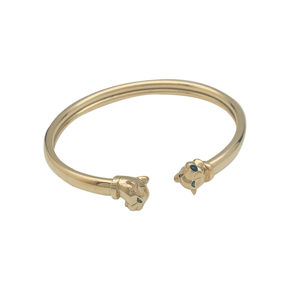Cartier "Panthère" bracelet in yellow gold, tsavorites and onyx.