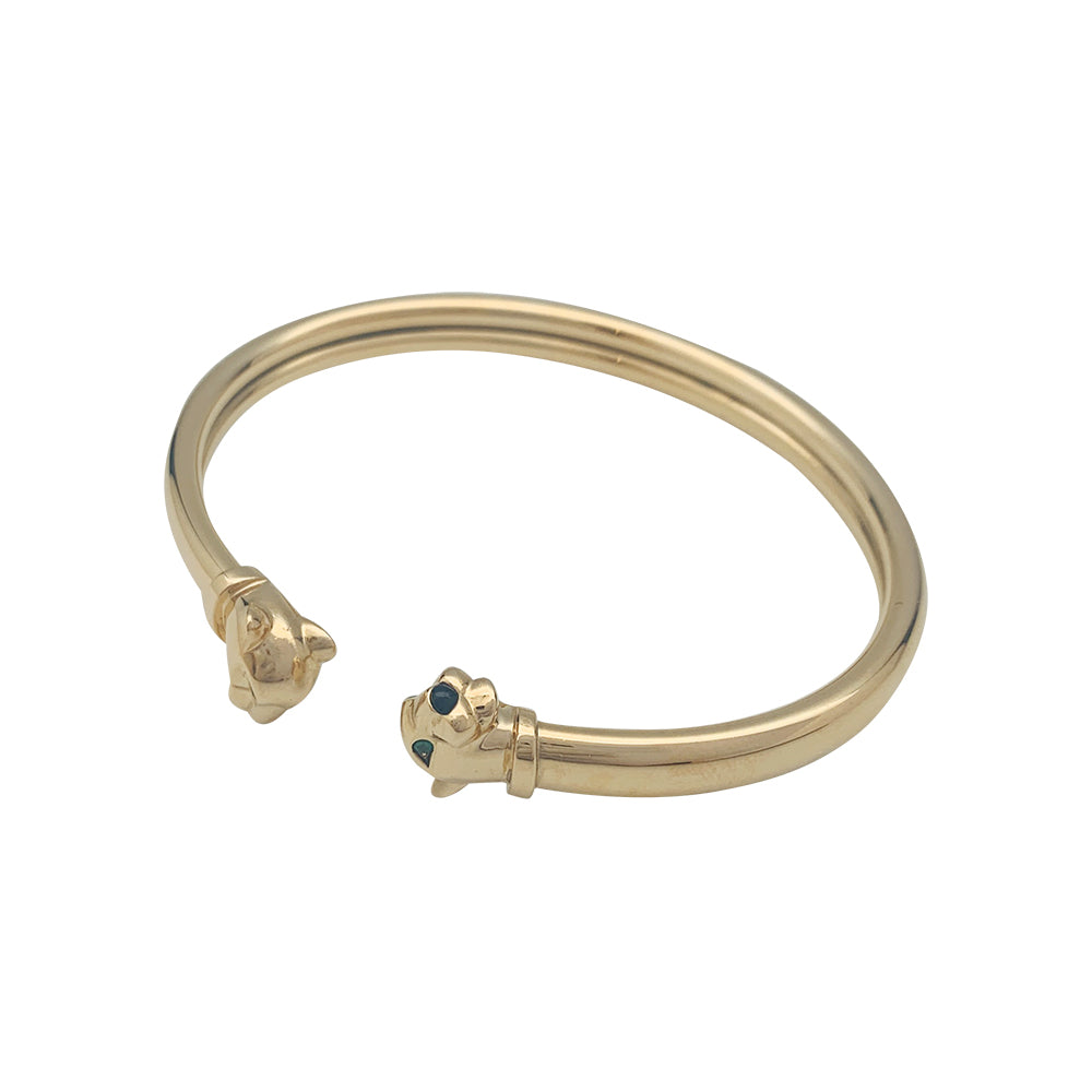 Cartier "Panthère" bracelet in yellow gold, tsavorites and onyx.