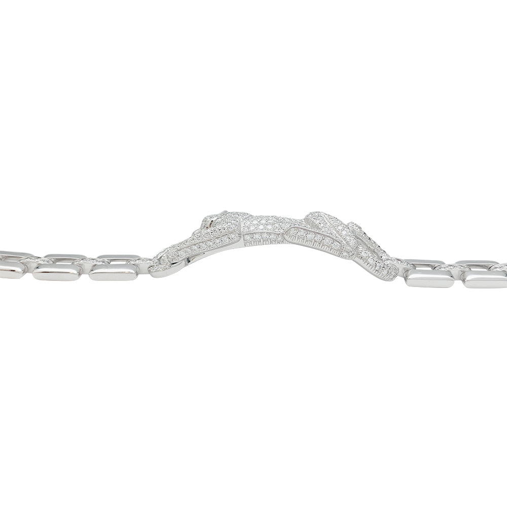 Cartier "Panthère de Cartier" bracelet in white gold, diamonds, emerald and onyx.