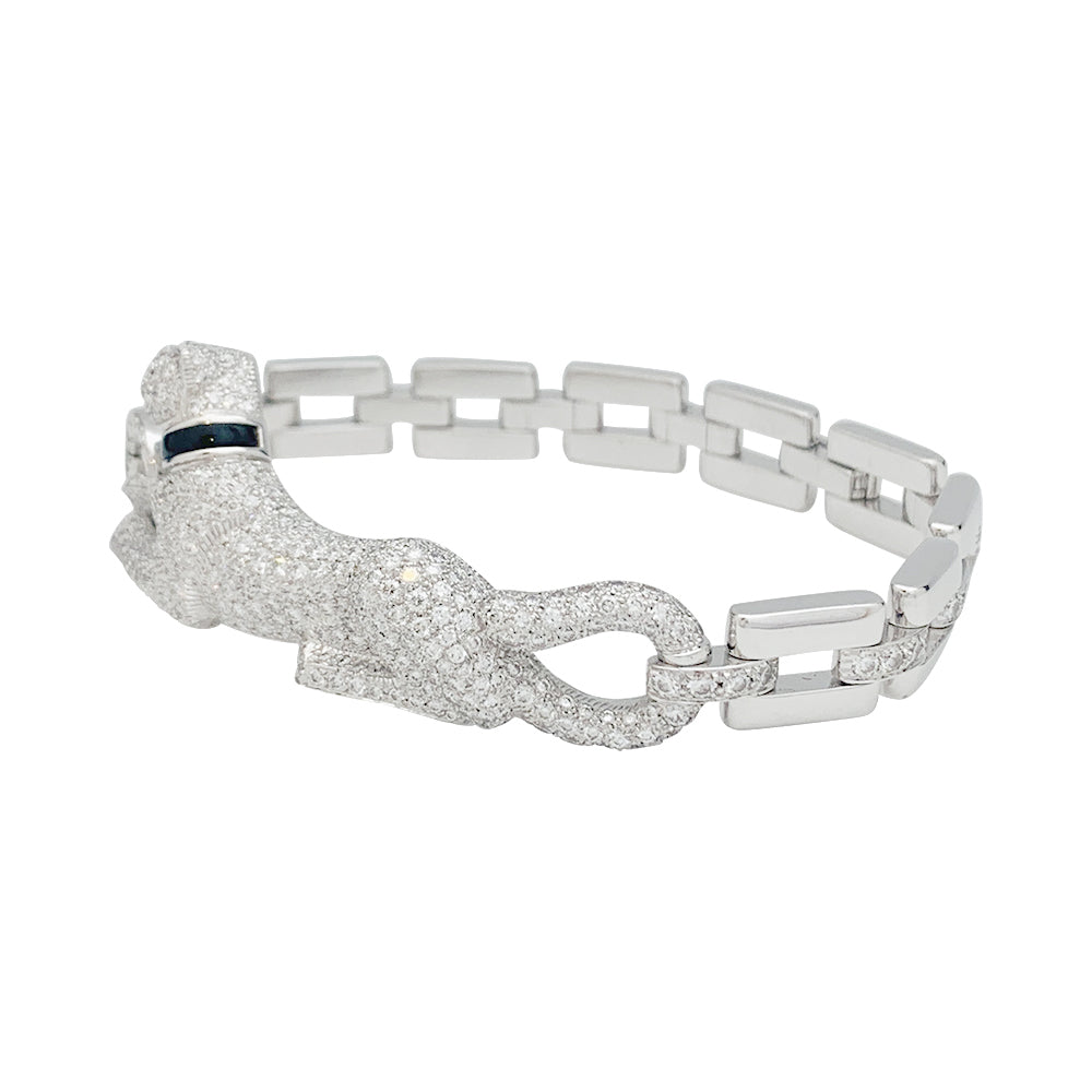 Cartier "Panthère de Cartier" bracelet in white gold, diamonds, emerald and onyx.