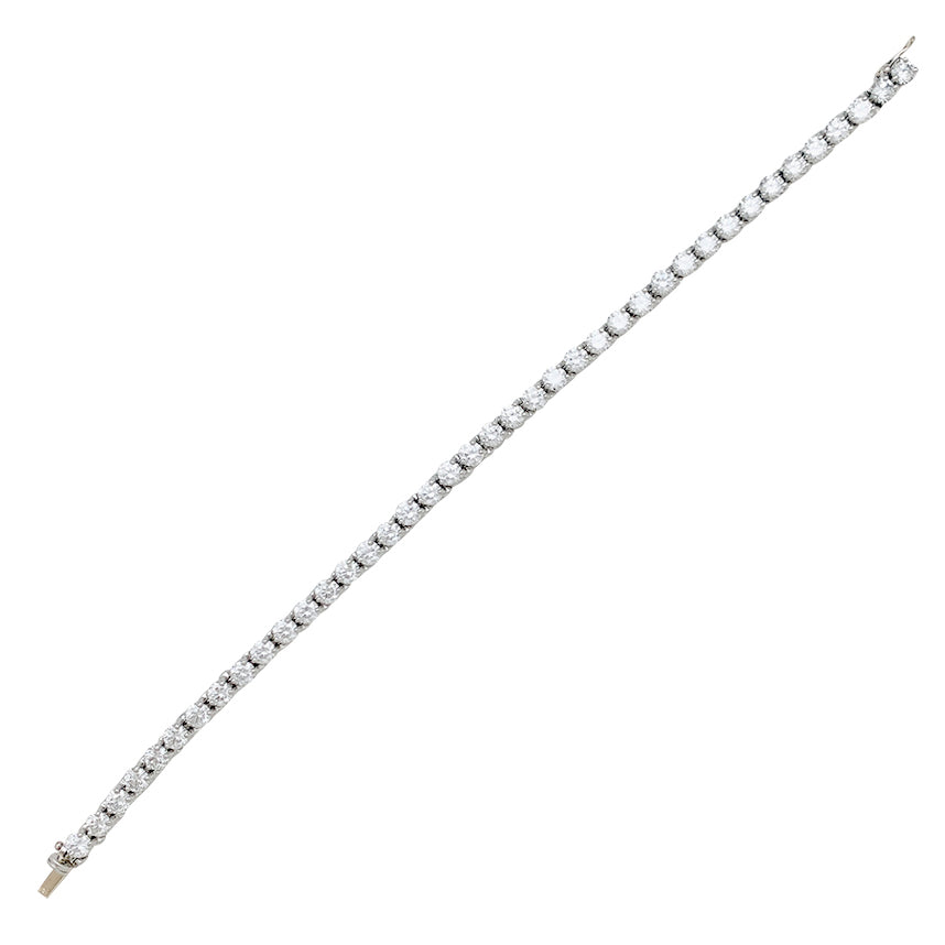 Cartier, "Lignes Essentielles" bracelet, in platinum set with diamonds.