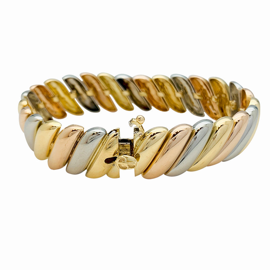 Poiray bracelet in three shades of gold.