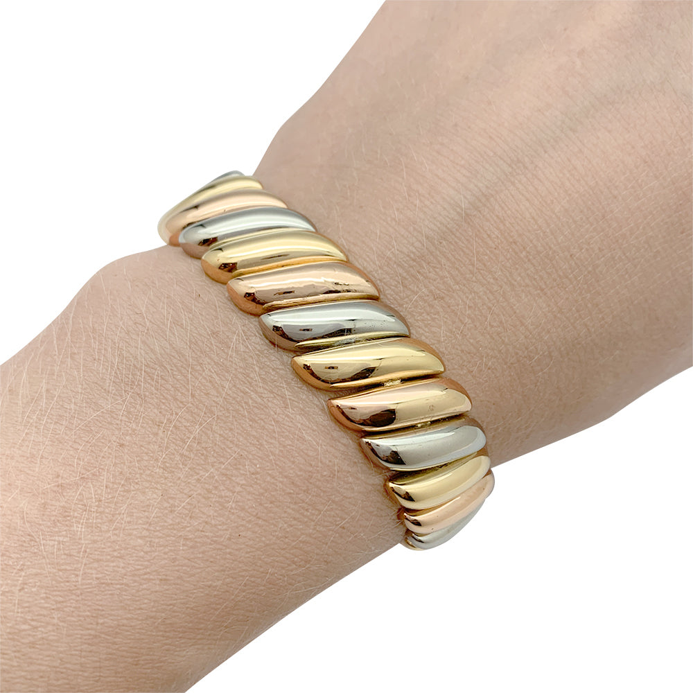 Poiray bracelet in three shades of gold.