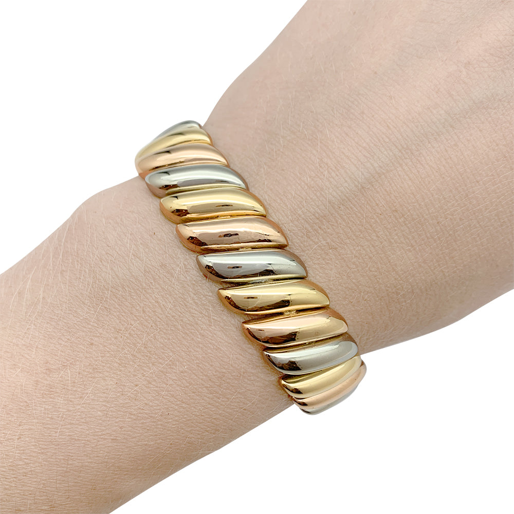 Poiray bracelet in three shades of gold.