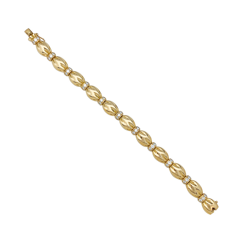 Van Cleef & Arpels bracelet, "Drapé", yellow gold, diamonds.