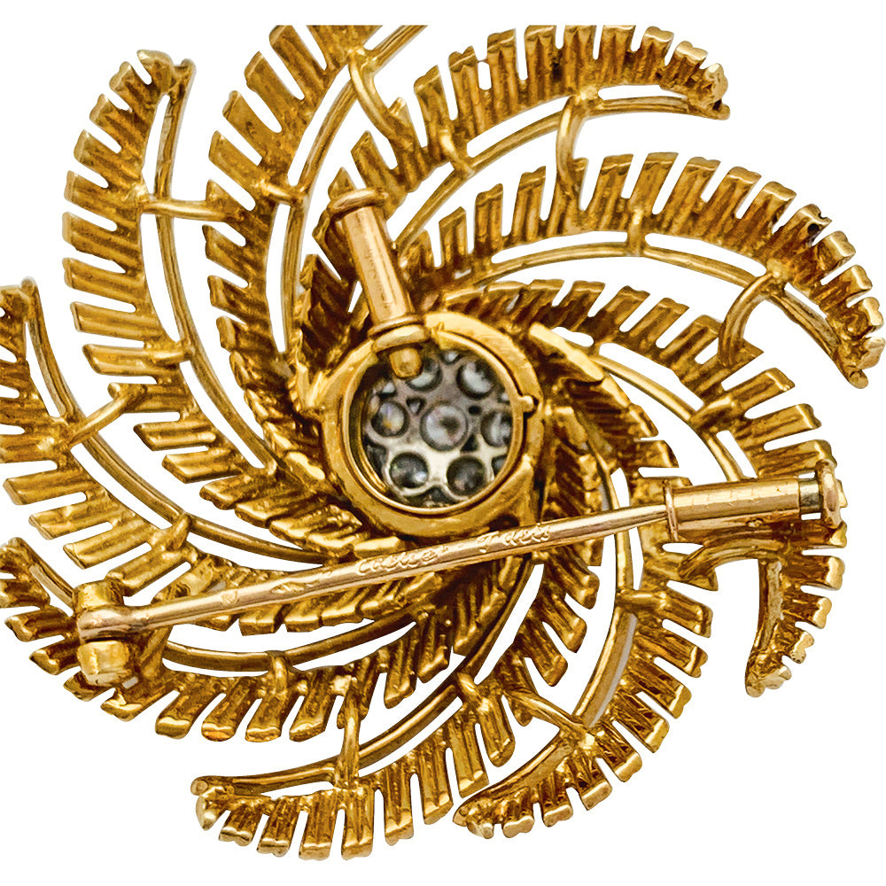 Vintage Cartier clip, yellow gold and diamonds.