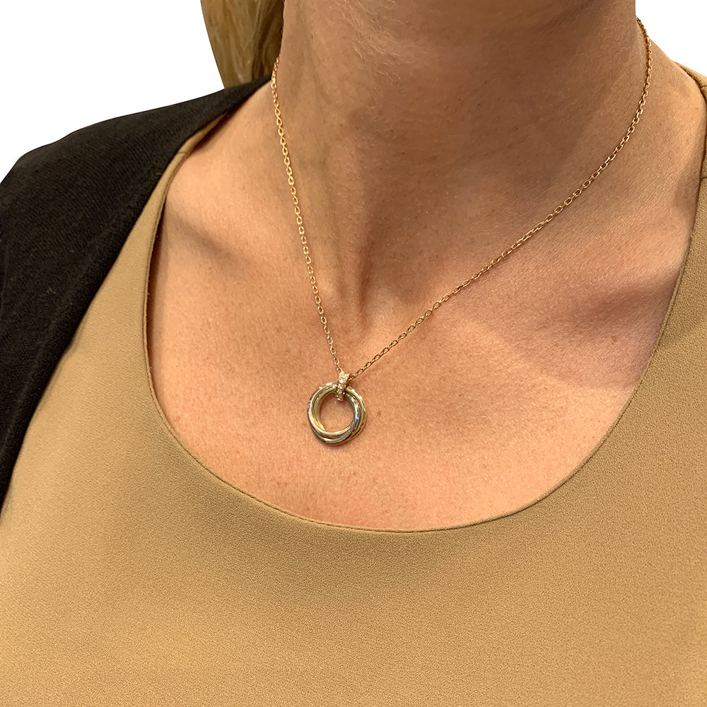 Cartier necklace, "Trinity", three golds, diamonds.