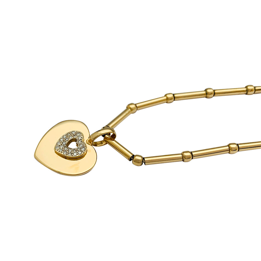Poiray "Coeur Secret" necklace in yellow gold, diamonds.