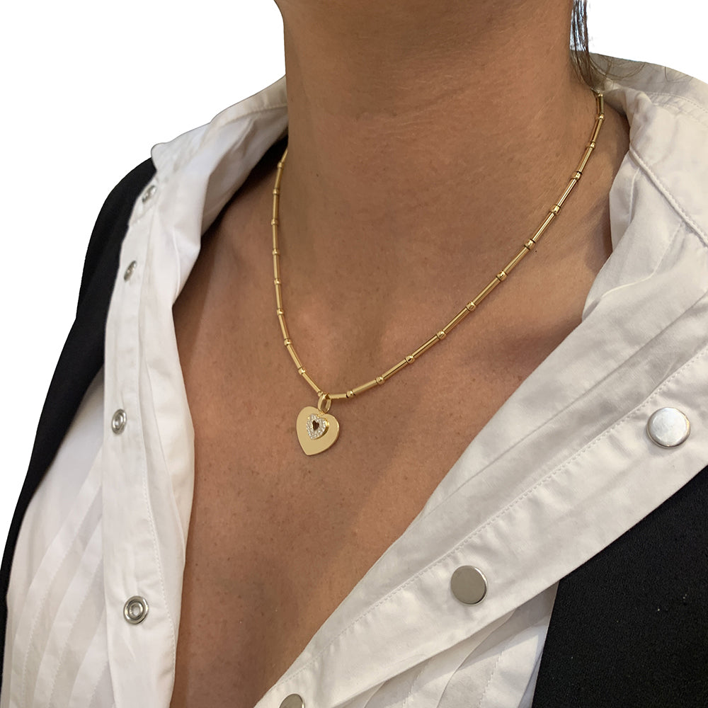Poiray "Coeur Secret" necklace in yellow gold, diamonds.