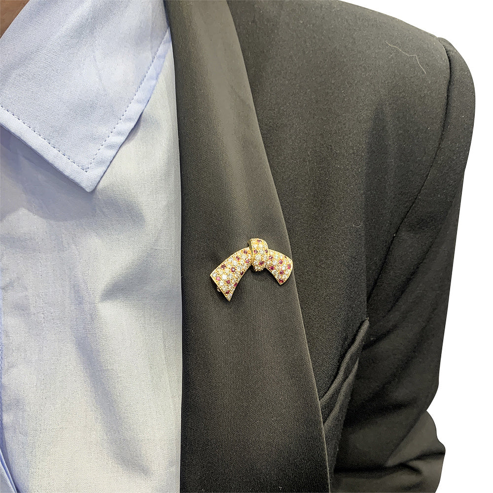 Van Cleef & Arpels transformable necklace, yellow gold, rubies, diamonds.