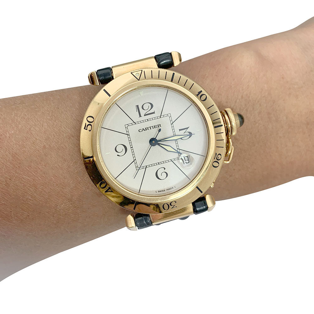 Cartier "Pasha" watch in yellow gold, leather.