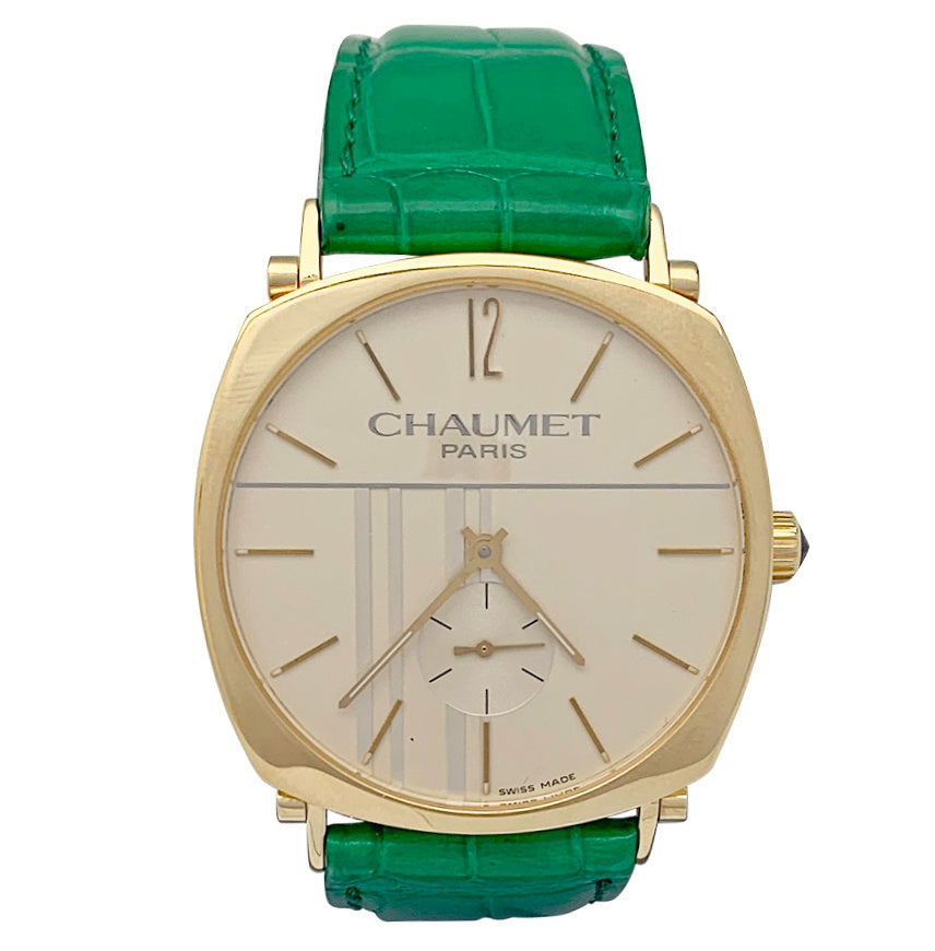 Montre Chaumet, "Dandy" en or jaune sur cuir.