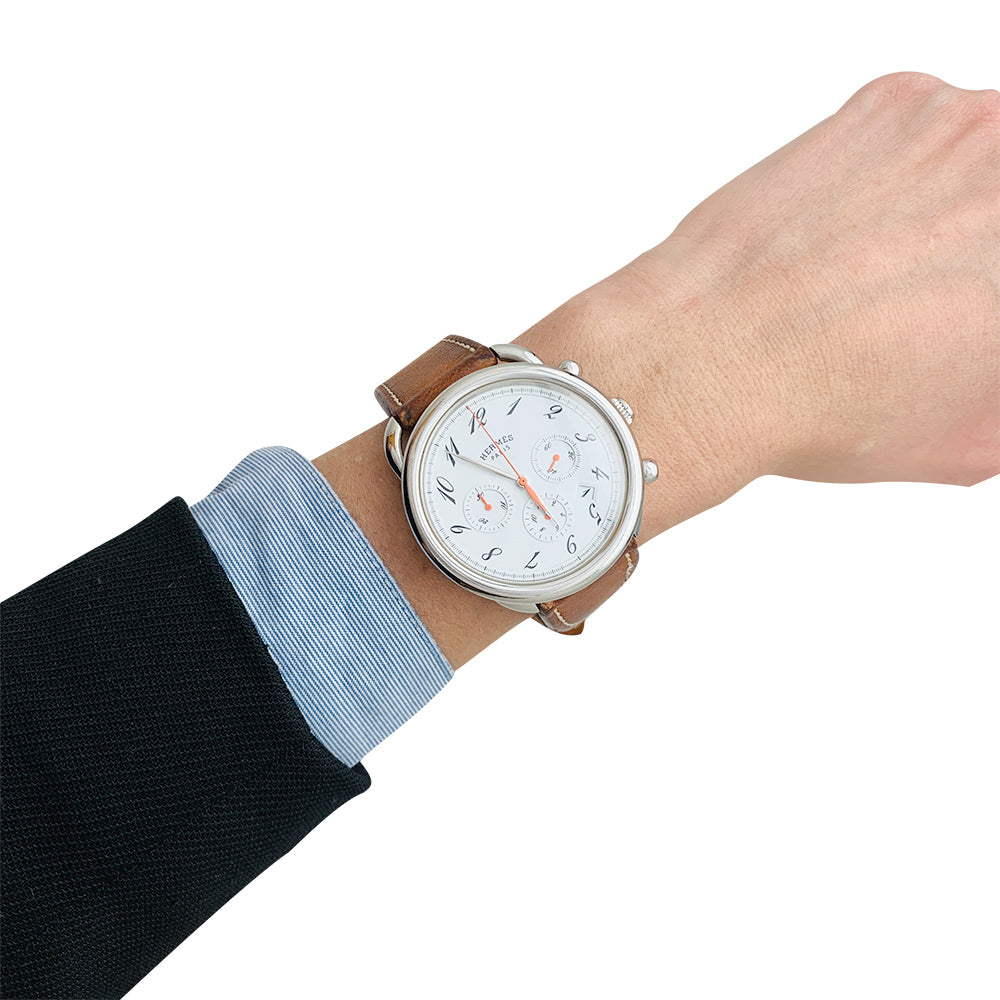 Hermès "Arceau" chronograph watch in steel and leather.