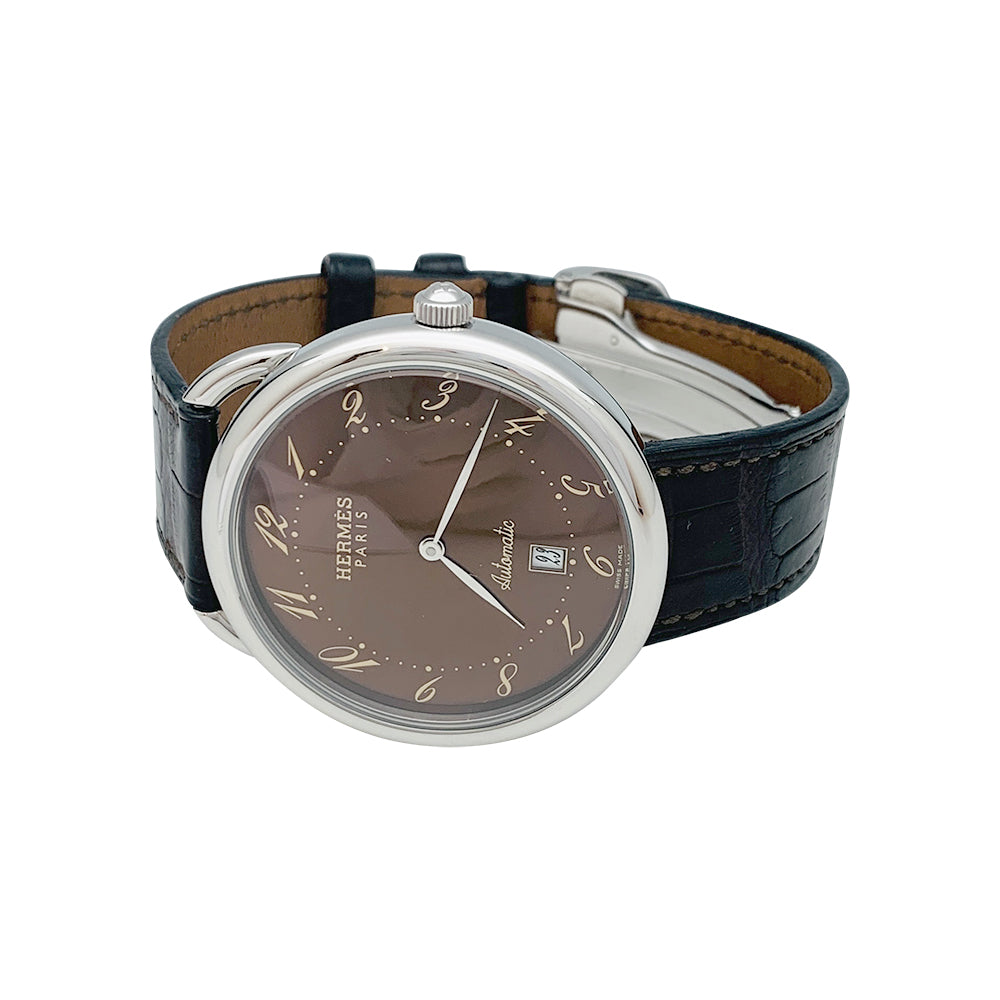 Hermès "Arceau TGM" steel watch on leather.