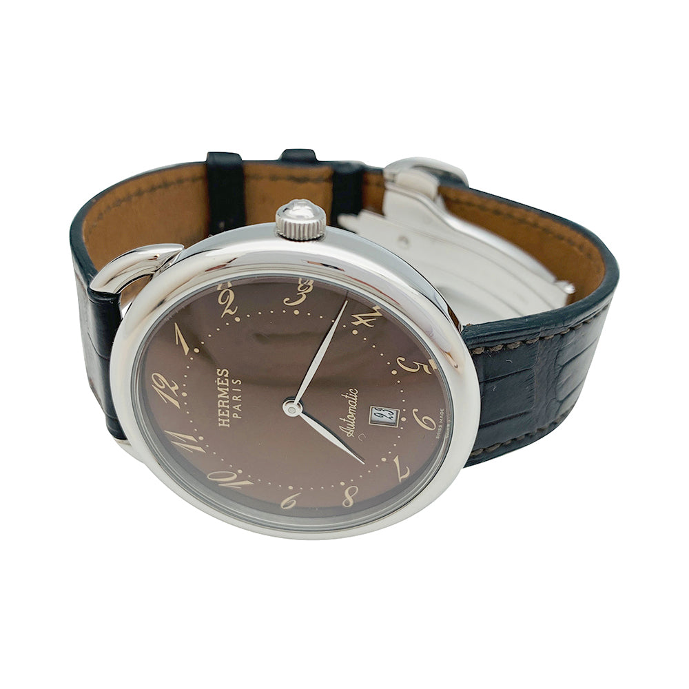 Hermès "Arceau TGM" steel watch on leather.