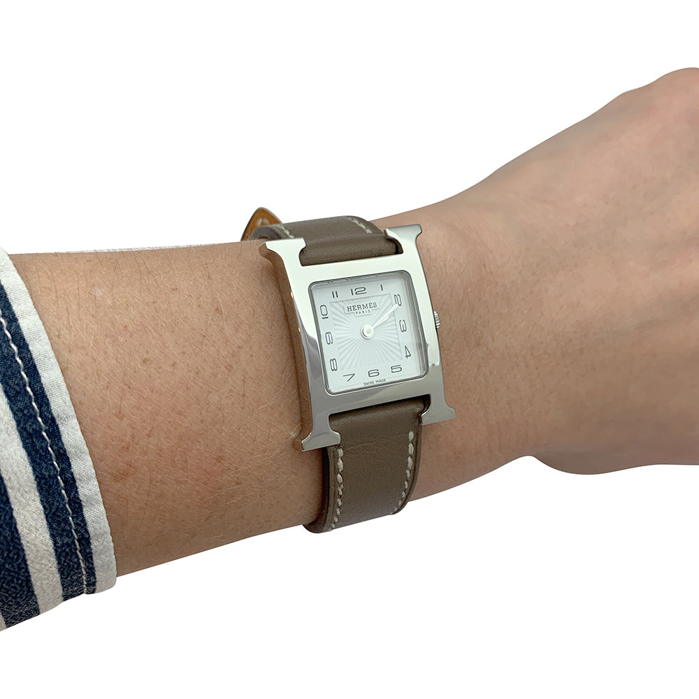 Hermès "Heure H" watch in steel and leather.