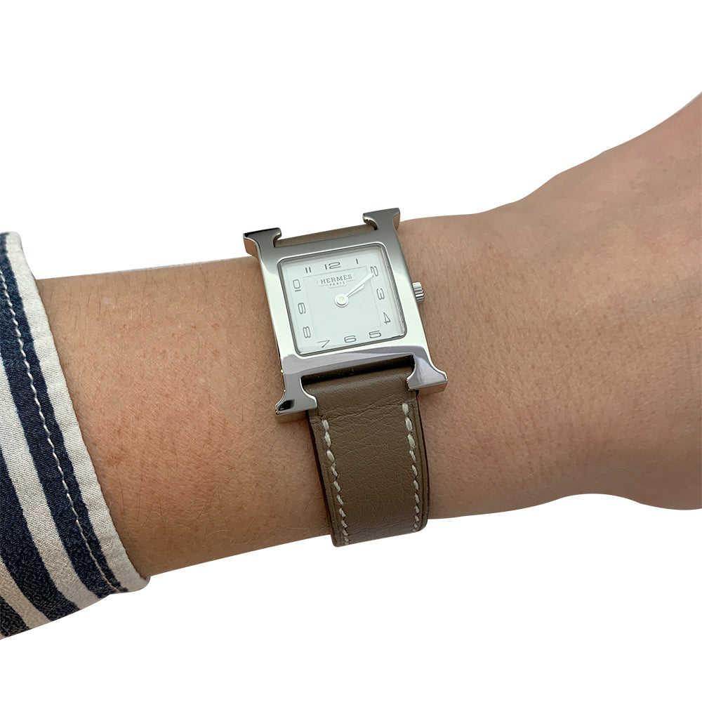 Hermès "Heure H" watch in steel and leather.