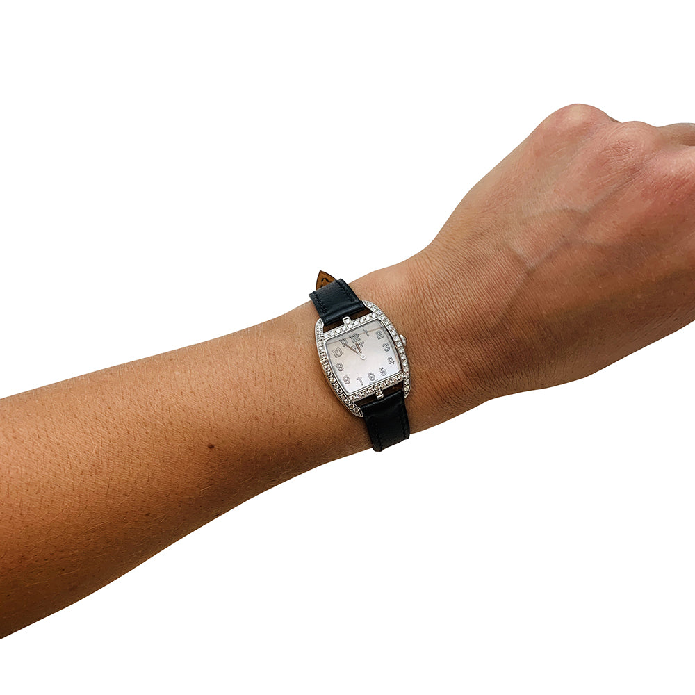 Hermès watch, "Cape Cod Tonneau" model, in steel and diamonds on leather.