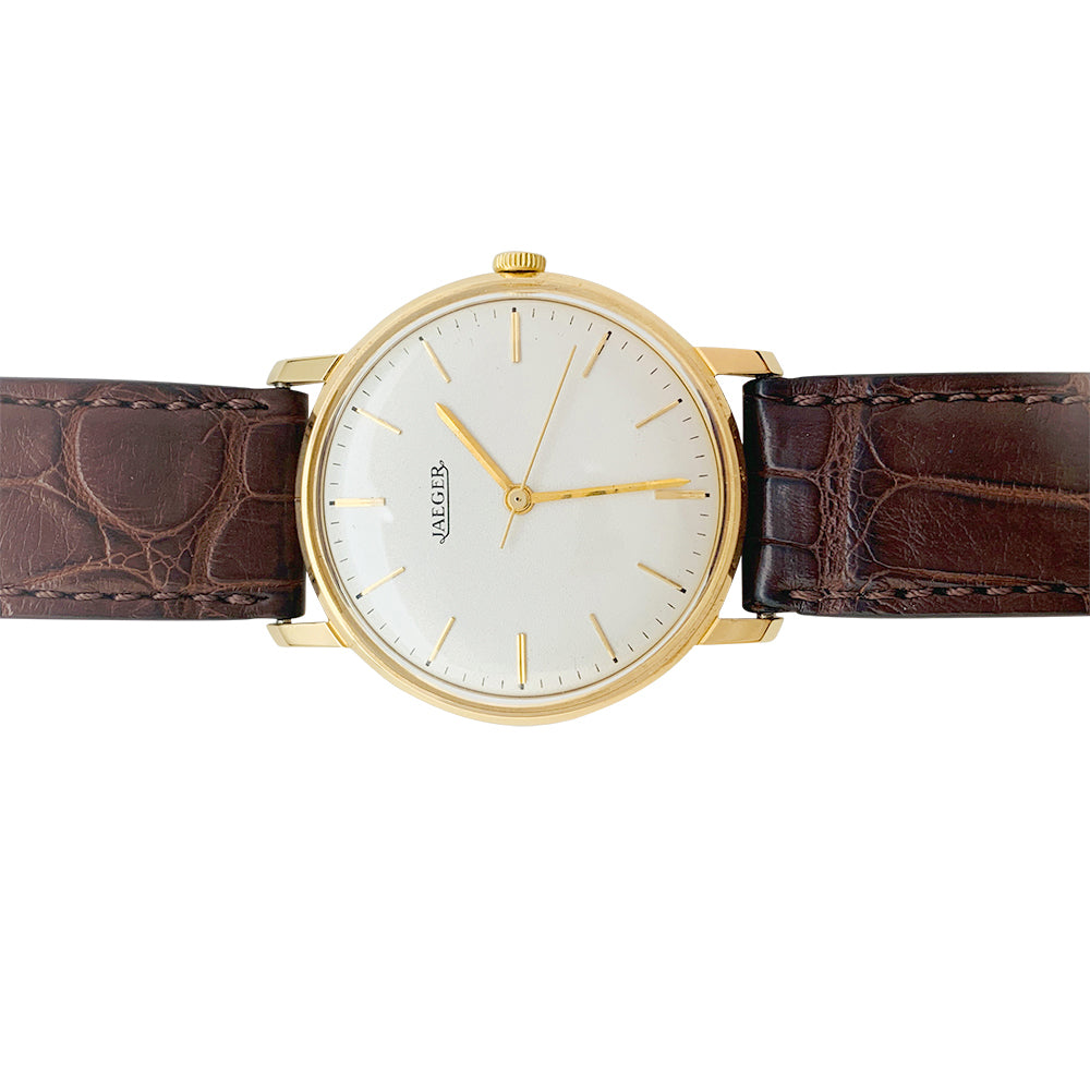 Montre Jaeger en or rose, bracelet cuir.