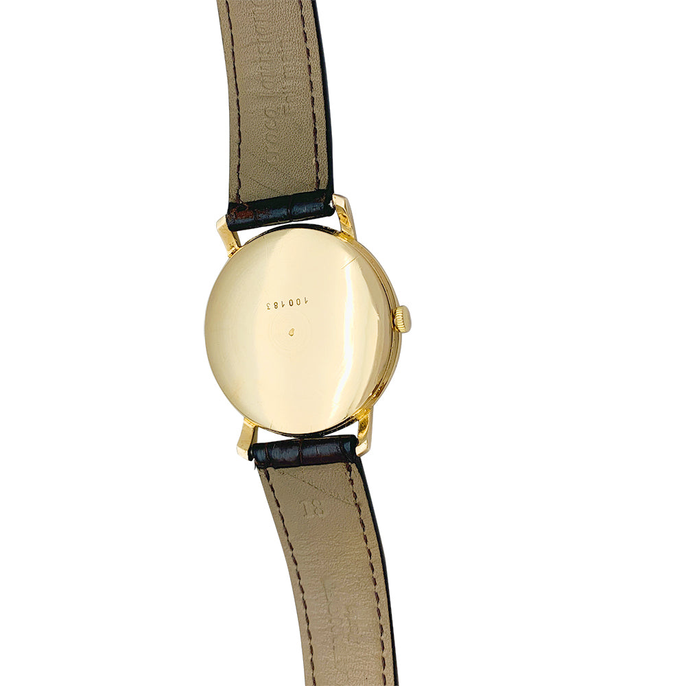 Montre Jaeger en or rose, bracelet cuir.