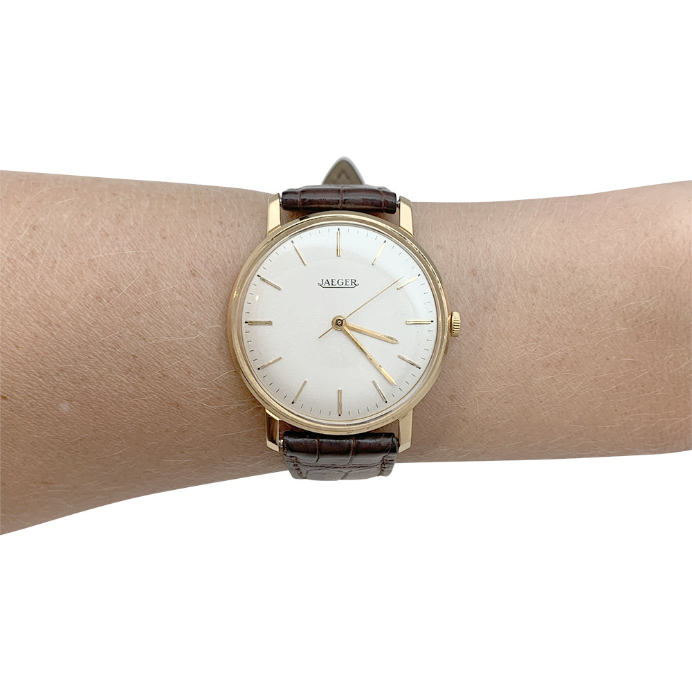 Montre Jaeger en or rose, bracelet cuir.