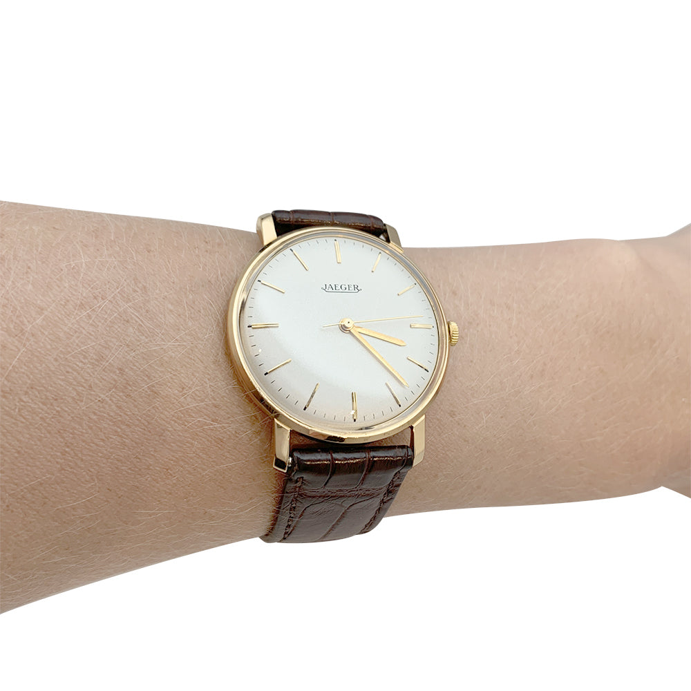 Montre Jaeger en or rose, bracelet cuir.