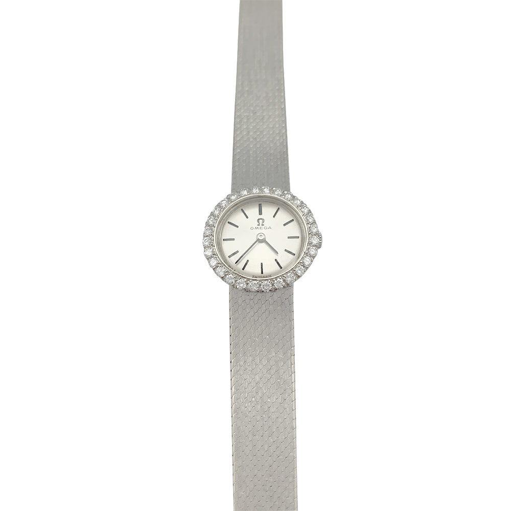 Montre Omega or blanc et diamants.