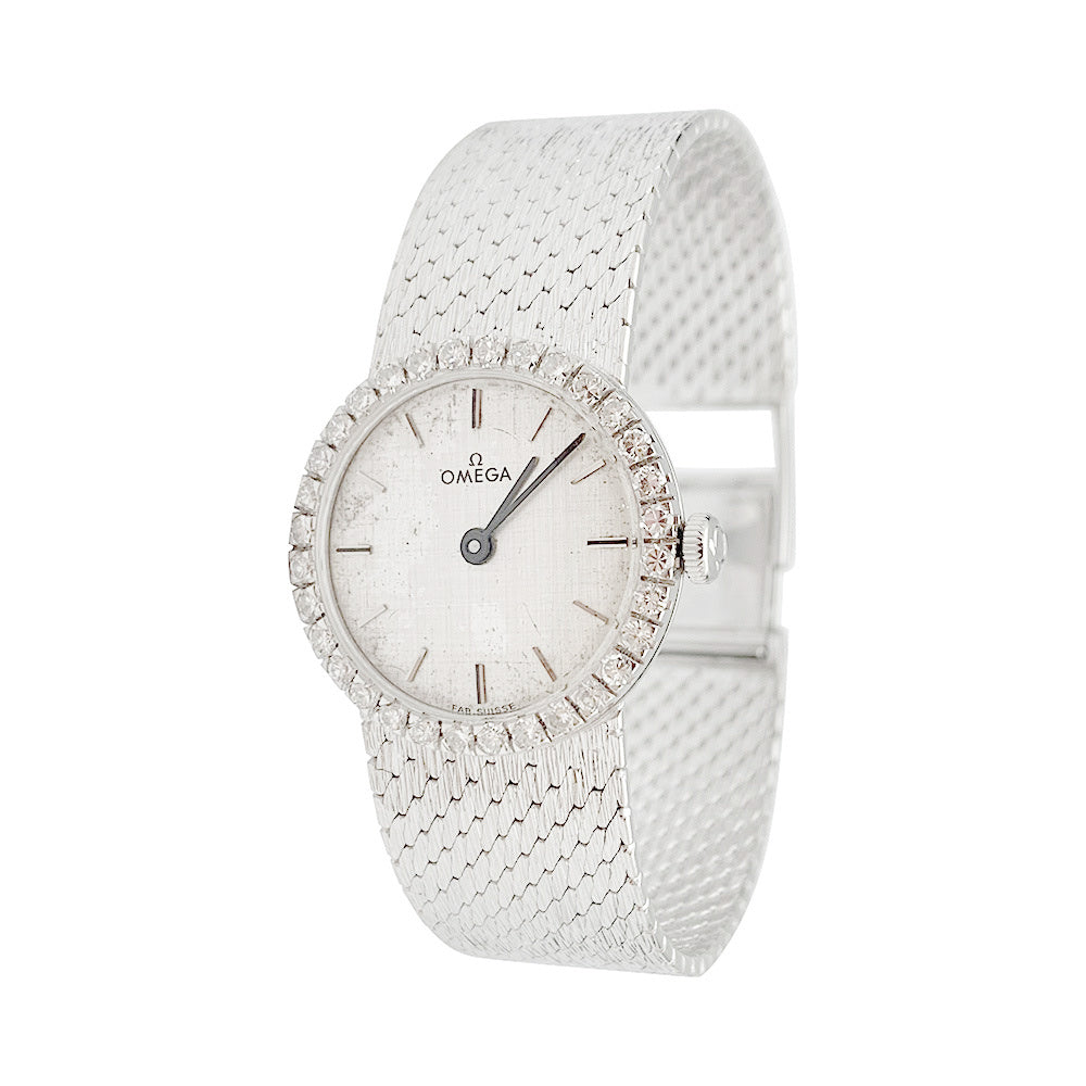 Montre Omega or blanc et diamants.