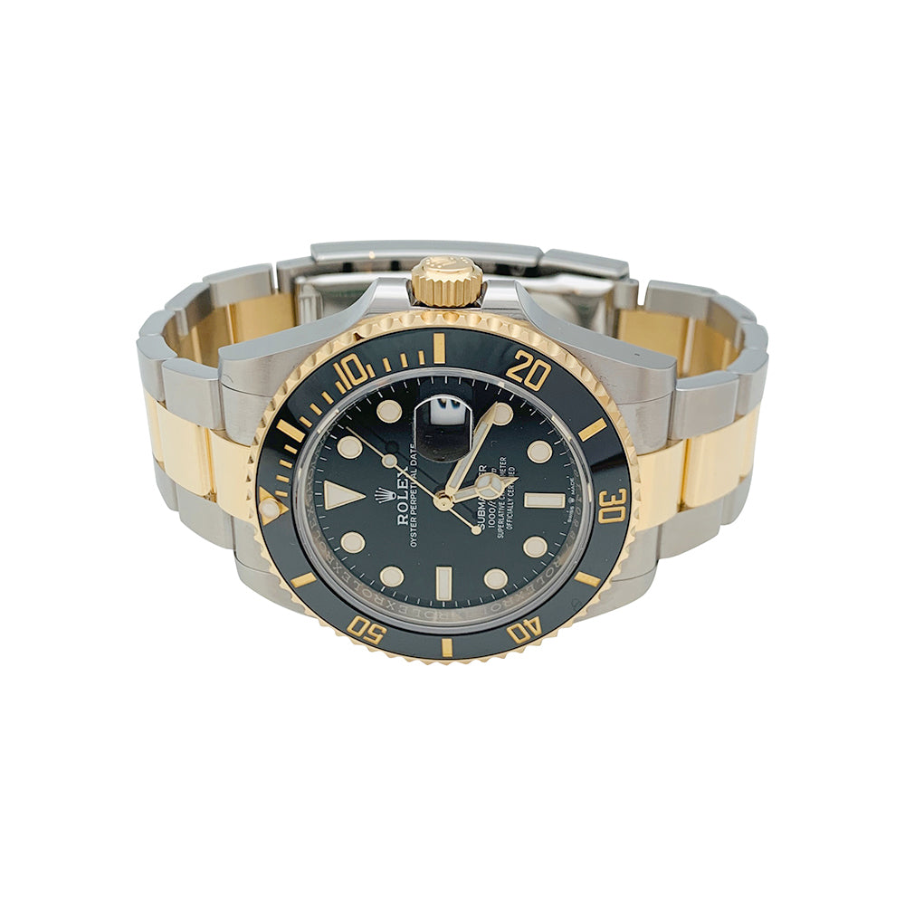 Rolex Submariner watch, yellow gold and steel.