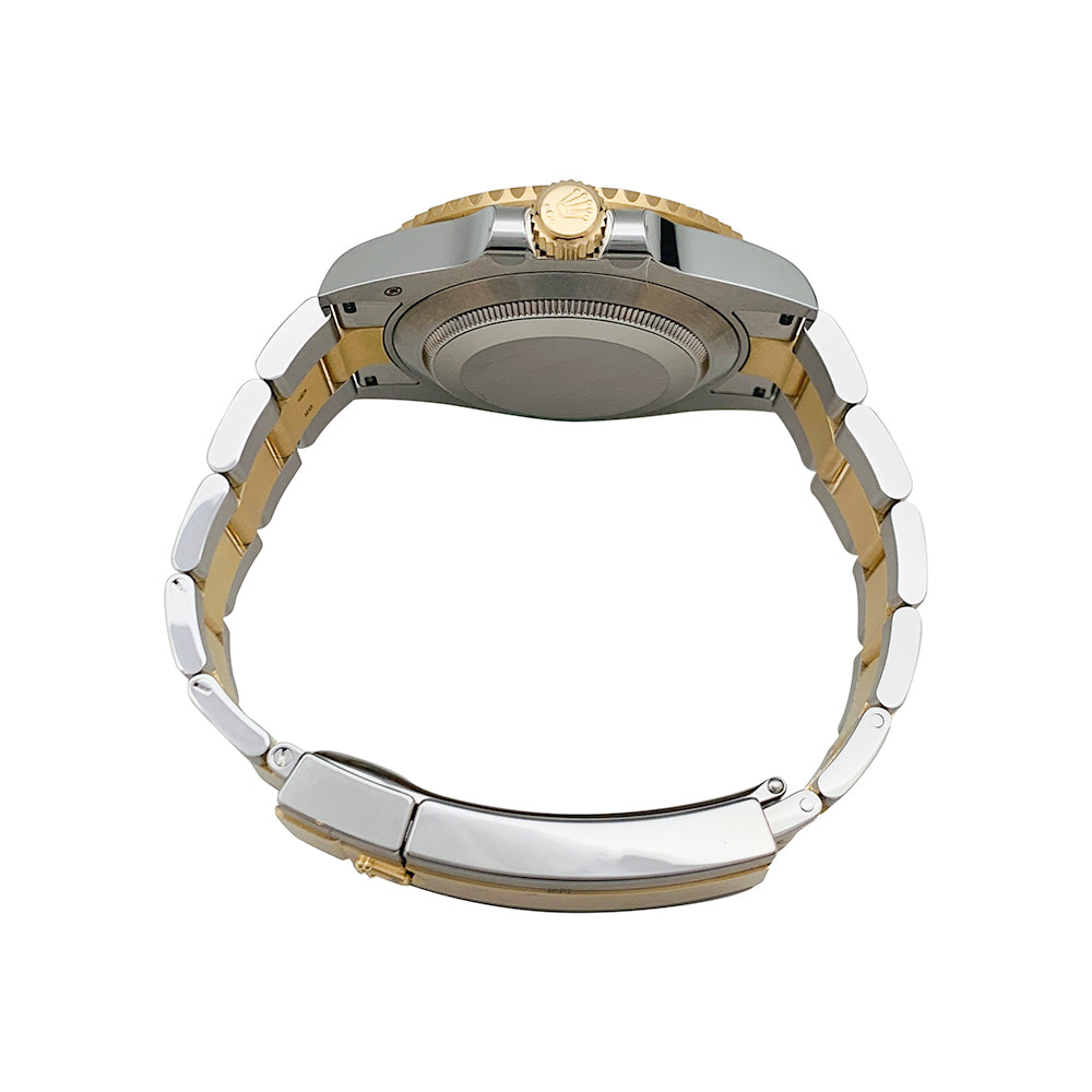 Rolex Submariner watch, yellow gold and steel.
