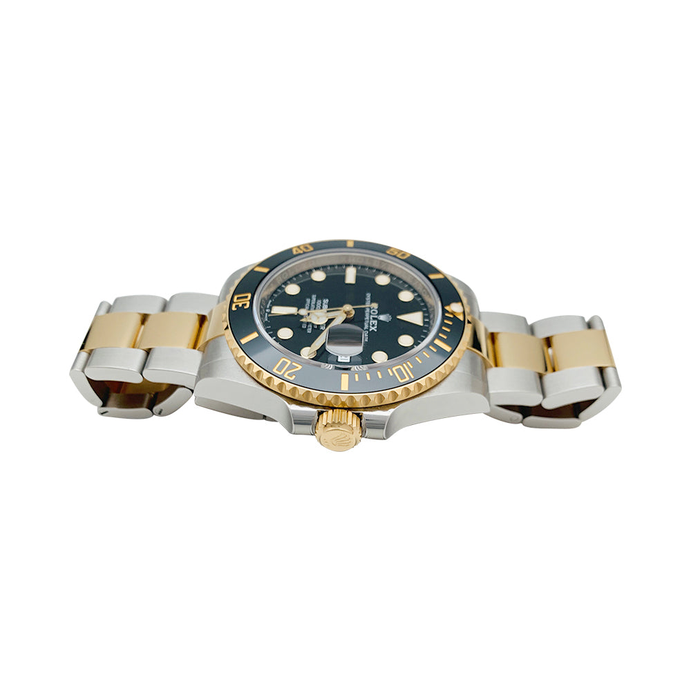 Montre Rolex Submariner, or jaune et acier.