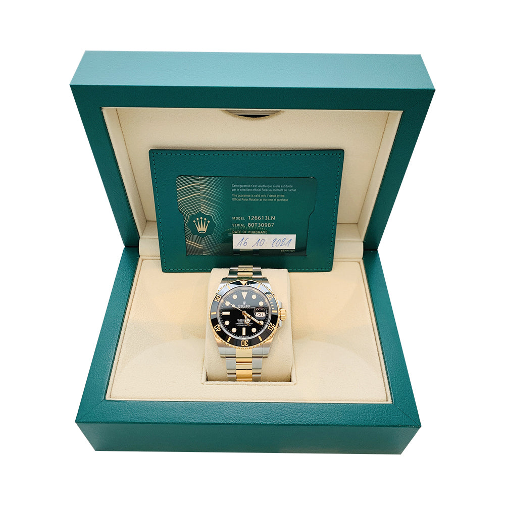 Rolex Submariner watch, yellow gold and steel.