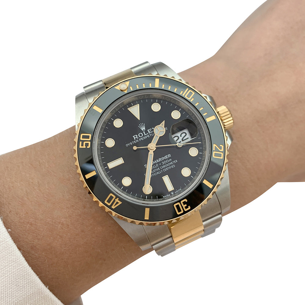 Rolex Submariner watch, yellow gold and steel.