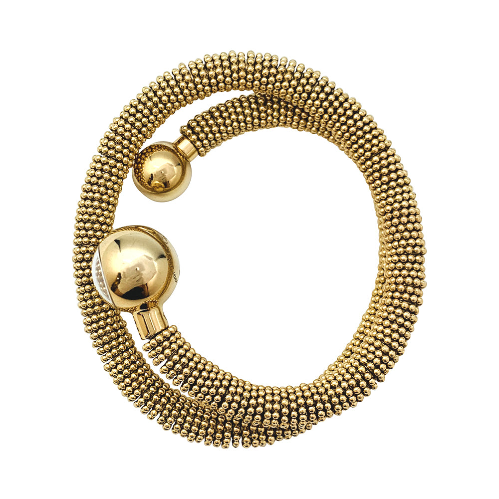 Van Cleef & Arpels "Liane Serpent" three-turn watch in yellow gold.