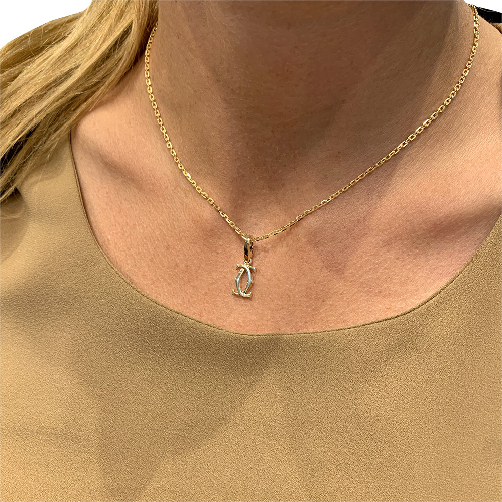 Cartier "Double C" Charm Pendant, yellow gold.
