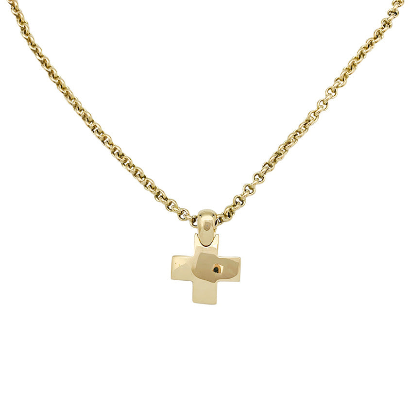 Pomellato "Cross" pendant and chain in yellow gold.