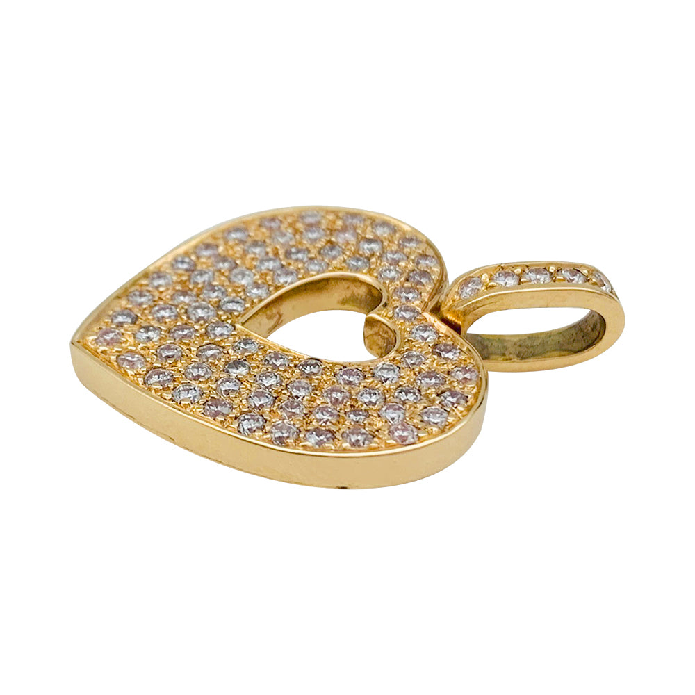 Pendentif Poiray, "Coeur secret", en or jaune et diamants.