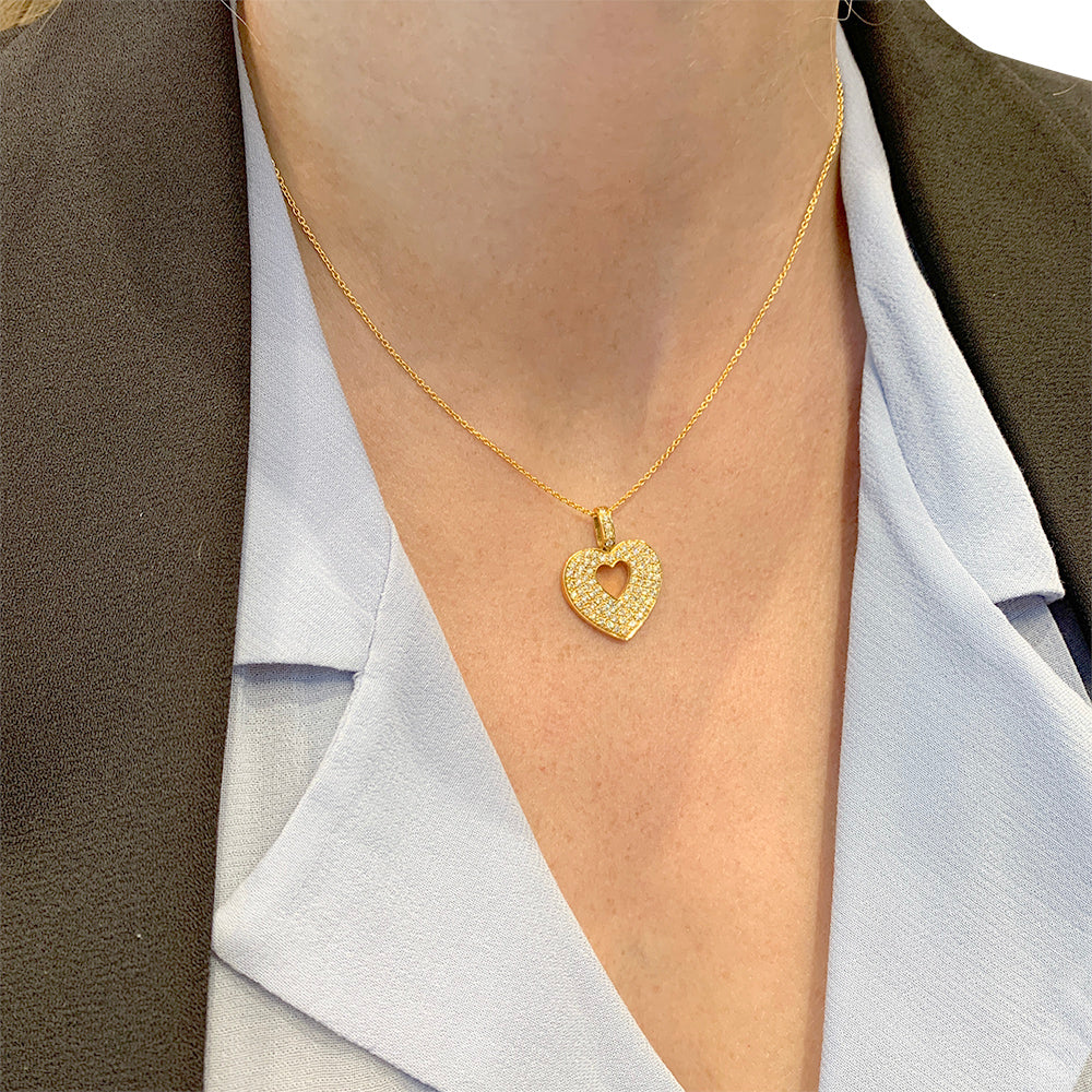 Poiray pendant, "Secret Heart", in yellow gold and diamonds.