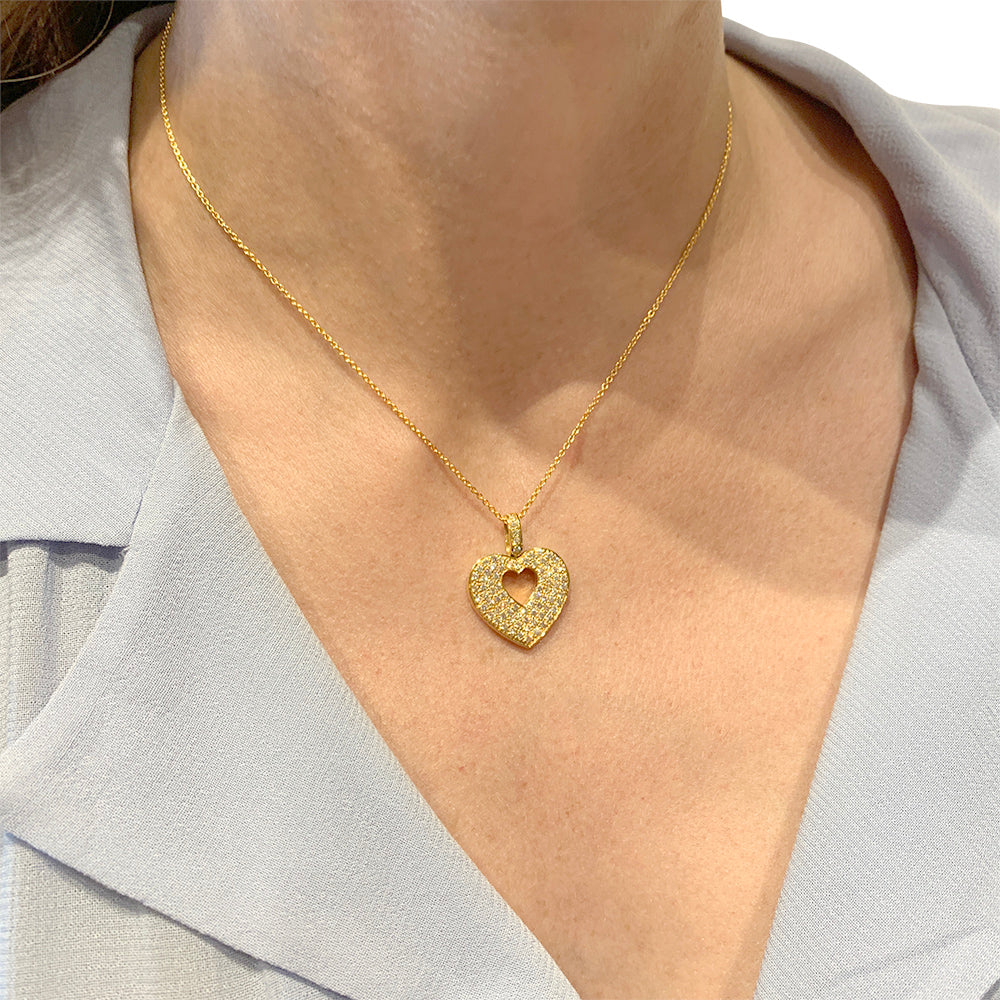 Poiray pendant, "Secret Heart", in yellow gold and diamonds.