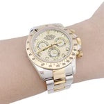 Montre Rolex, "Cosmograph Daytona", or jaune et acier.